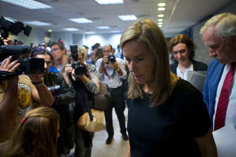 Spain's Health Minister Ana Mato walks past members of the media as she leaves a news conference on the first reported incident of Ebola transmission outside Africa, in Madrid, Spain, Monday, Oct. 6, 2014. A Spanish nurse who treated a missionary for the disease at a Madrid hospital tested positive for the virus, Mato said Monday. The female nurse was part of the medical team that treated a 69-year-old Spanish priest who died in a hospital last month after being flown back from Sierra Leone, where he was posted. (AP Photo/Paul White)