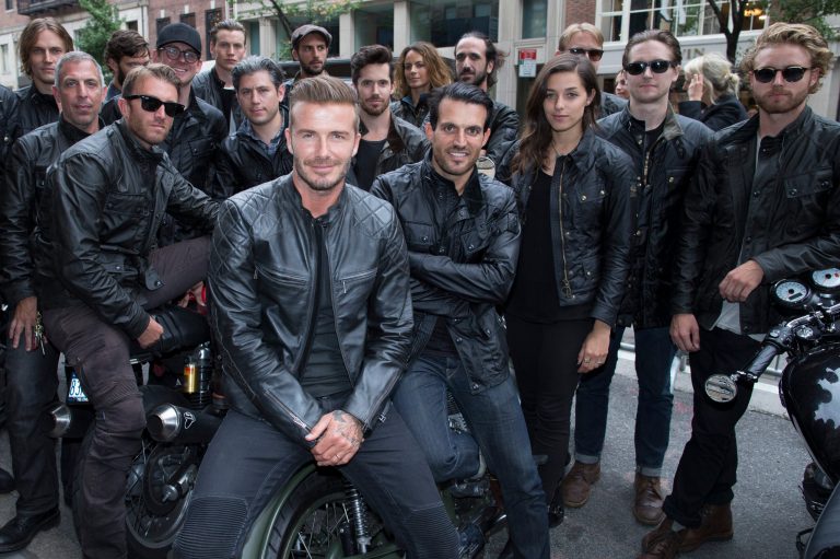 David Beckham poses for a photograph with motorcyclists as he promotes the Beckham for Belstaff collection during Fashion Week, Tuesday, Sept. 9, 2014, in New York. (AP Photo/John Minchillo)