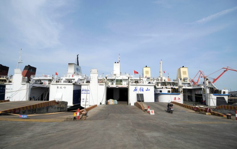 In this Sunday, May 18, 2014 photo released by China's Xinhua News Agency, passenger ships Wuzhishan, center, and Tongguling,  left, are moored before setting sail to Vietnam , at Xiuying port in Haikou, capital of south China's Hainan Province.  A port official said the two Chinese passenger ships have arrived at a central Vietnamese port to evacuate Chinese nationals following deadly rioting last week. The official said the boats with a capacity of 1,000 passengers each arrived at Vung Ang early Monday, May 19. (AP Photo/Xinhua, Wei Hua) NO SALES