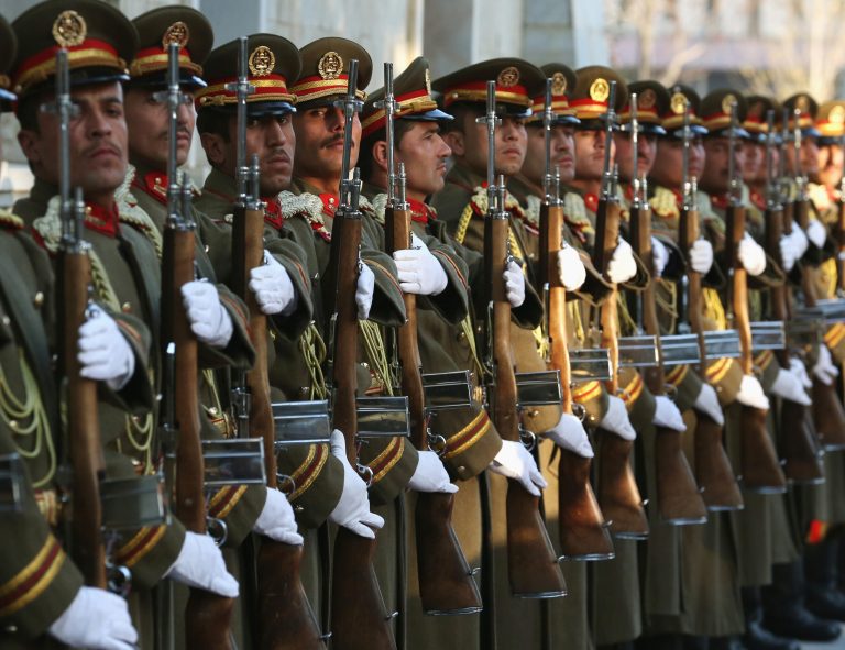 Afghan troops participate in an arrival ceremony for U.S. Secretary of Defense Chuck Hagel at the Presidential Palace, Saturday, Dec. 6, 2014 in Kabul. Based on the growth of Afghanistan's economy, the country will be unable to fund its military by a deadline of 2024. (AP Photo/Mark Wilson, Pool)