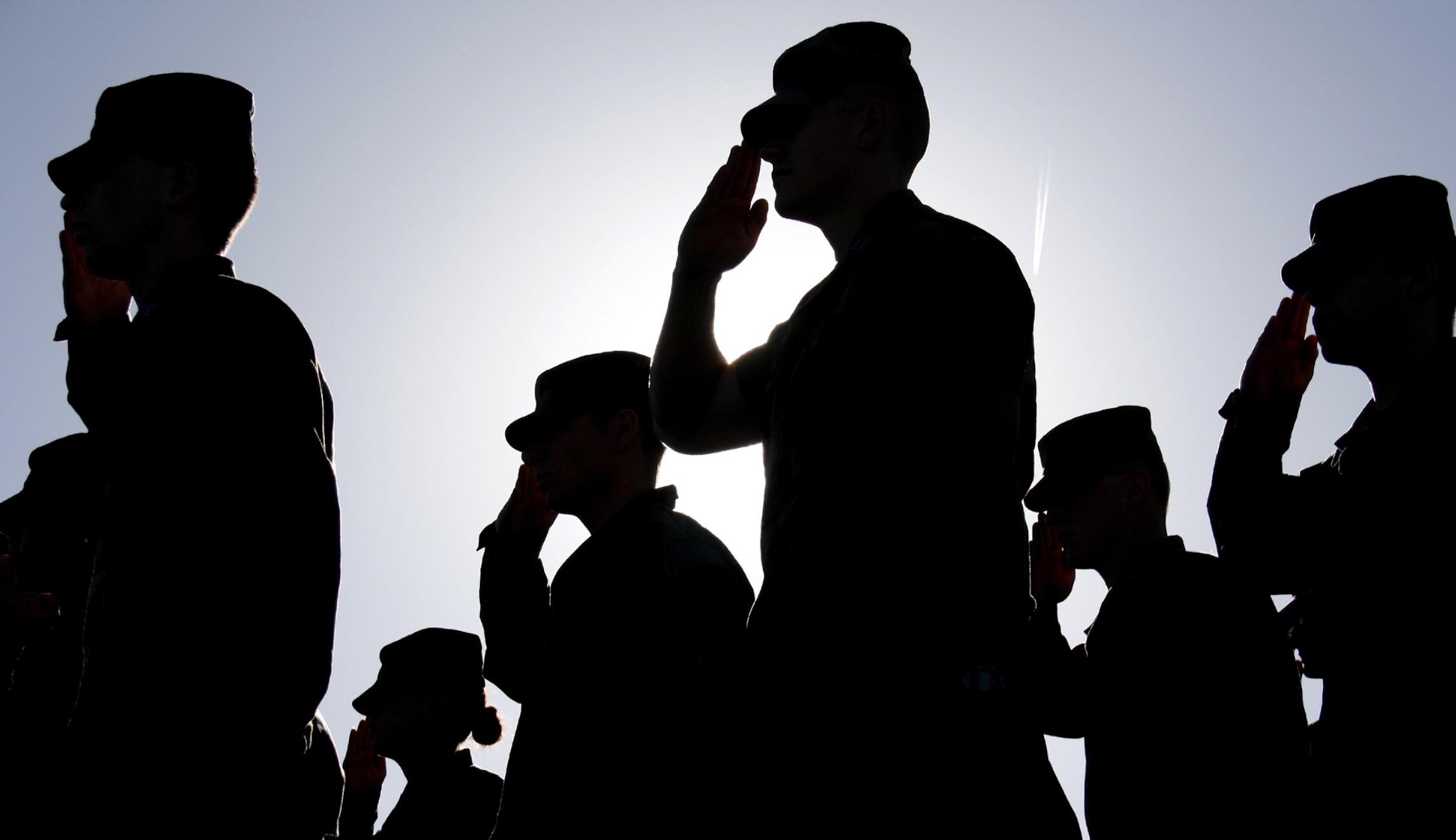 Soldiers Salute Flag at Sunset