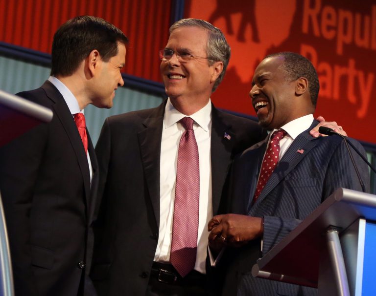 Republican presidential candidates from left, Marco Rubio, Jeb Bush and Ben Carson talk during a break during the first Republican presidential debate at the Quicken Loans Arena Thursday, Aug. 6, 2015, in Cleveland. (AP Photo/Andrew Harnik)