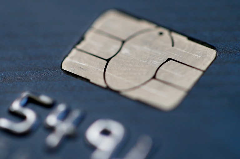 Visa set up technical requirements for new chip card readers that interfered with merchants' ability to decide which network to use. (AP Photo/Matt Rourke)