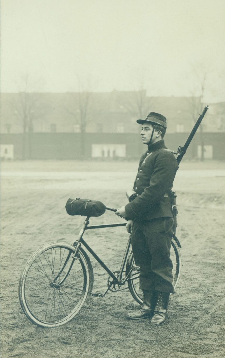 In this undated photo provided by the WielerMuseum Roeselare, a Belgian World War I soldier with his bicycle in Belgium during wartime. Late in the 19th century the Belgian Army took an interest in the newly emerging sport of cycling. A separate unit was created and came to be known as the Cyclist Riflemen. During World War I they played a key role in the Battle of Haelen in Belgium. The German Army nicknamed them the Black Devils, owing to their black outfits and hats, as well as their fast silent movements. (AP Photo/WielerMuseum)