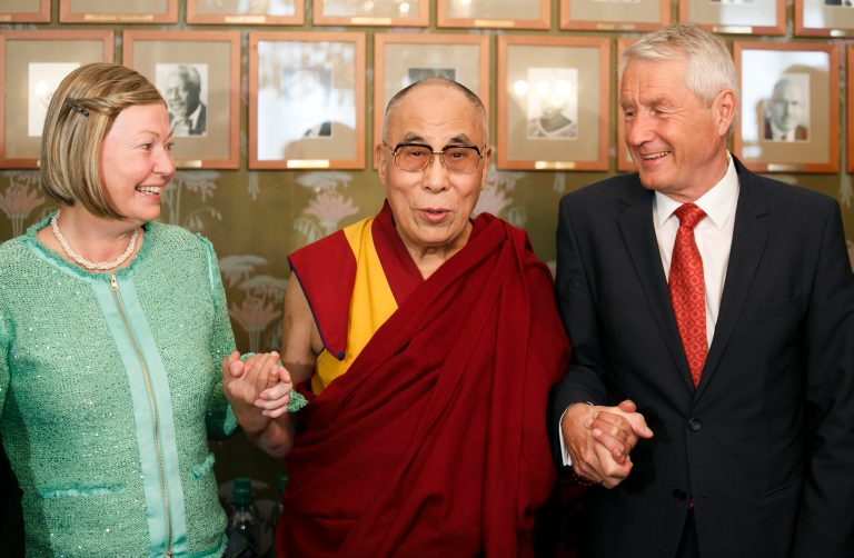 Dalai Lama stands with chairman of the Norwegian Nobel Committee Thorbjorn Jagland, right, and deputy chairwoman Kaci Kullmann Five from the Nobel Peace Prize committee, in Oslo, Wednesday May 7, 2014. Norway's decision to shun the Dalai Lama during his visit to Oslo this week has left a sour taste for a country that prides itself in being a beacon of human rights in the world. Unlike on his previous visits to Norway, no government officials will meet the 1989 Nobel Peace Prize laureate and Tibetan spiritual leader, who arrived in Oslo on Wednesday for a three-day stay. (AP Photo/Heiko Junge, NTB Scanpix) NORWAY OUT