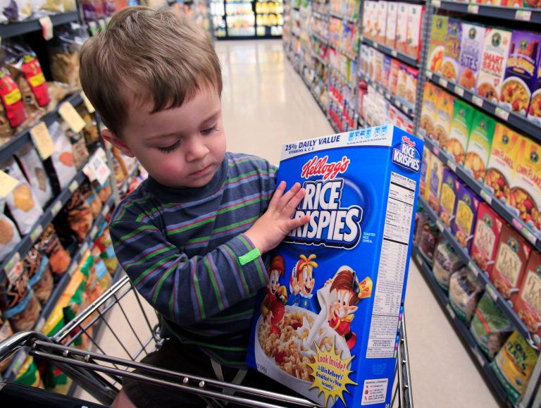 Evan Olmstead, 2, looks at Kellogg's Rice Krispies cereal at Piazza's grocery store in Palo Alto, Calif., Tuesday, May 3, 2011. (AP Photo/Paul Sakuma)