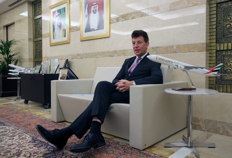 In this June 17, 2014, photo, Dubai Airports CEO Paul Griffiths, a 56-year-old Briton, talks to an Associated Press reporter at his office in Dubai, United Arab Emirates. Now that he's had a taste of running the world's busiest air hub for international passengers, Griffiths is determined to hang on to the honor while setting his sights on an even bigger prize: beating Atlanta for the title of busiest airport on the planet. (AP Photo/Kamran Jebreili)
