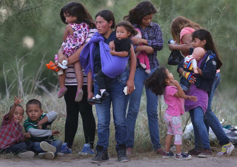 Central American immigrants await transportation to a U.S. Border Patrol processing center after crossing the Rio Grande from Mexico into the Texas on July 24, 2014 near Mission, Texas.Â About 70 percent of the roughly 40,000 migrant families apprehended between May and August did not report to an agency office as directed when they were turned loose.Â (Photo by John Moore/Getty images)