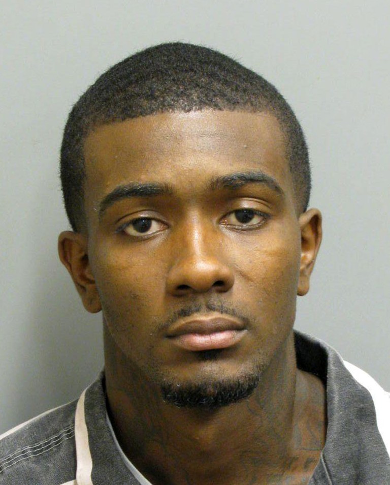   In this photo released Tuesday, June 12, 2012 by the Montgomery County Sheriff's Dept is a booking mug for Desmonte Leonard who is charged with three counts of murder and assault in a weekend shooting near Auburn University. Authorities say Leonard gave himself up in Montgomery Tuedsay evening. (AP Photo/Montgomery County Sheriff's Office)  