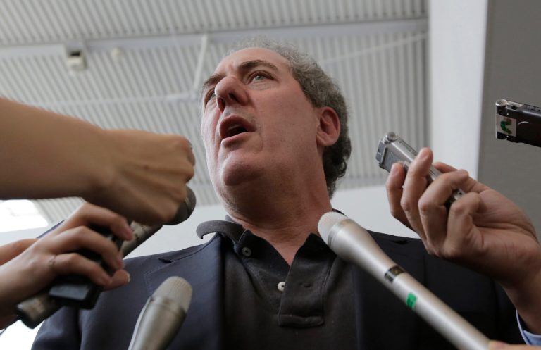 U.S. Trade Representative Michael Froman speaks to journalists upon his arrival at Narita International Airport in Narita, east of Tokyo, Tuesday, April 8, 2014. Froman's visit is expected for talks with his Japanese counterpart on a Pacific free trade pact. (AP Photo/Shizuo Kambayashi)