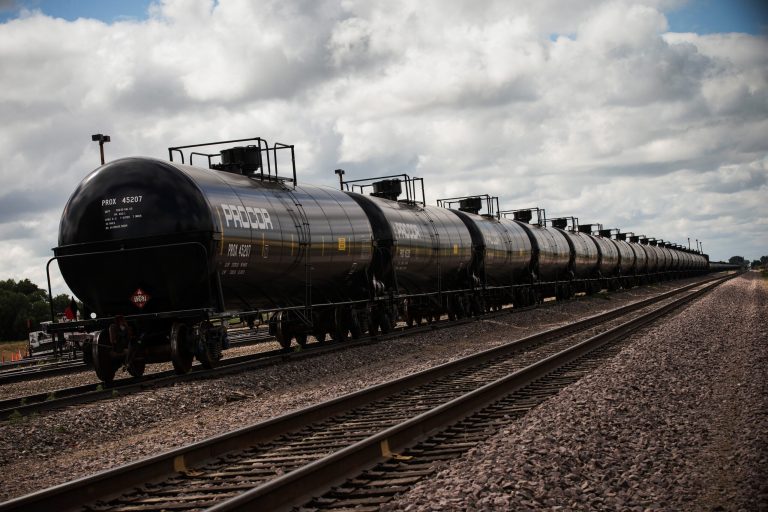Oil containers sit at a train depot on July 26, 2013 outside Williston, North Dakota. North Dakota produced a record 1.13 million barrels of oil per day in August, the state's Department of Mineral Resources said Wednesday.Â (Photo by Andrew Burton/Getty images)