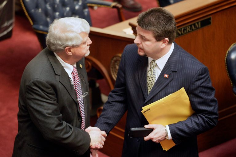 FILE - In this Tuesday, March 5, 2013 file photo, Sen. Jason Rapert, R-Conway, right, greets Sen. Bobby J. Pierce, D-Sheridan, on the floor of the senate chamber at the Arkansas state Capitol in Little Rock, Ark. Pierce voted against an override of Gov. Mike Beebe's veto of Rapert's legislation that would ban most abortions from the 12th week of pregnancy onward. By adopting the nation's toughest abortion law in the face of certain legal challenge, Arkansas legislators have exposed sharp tactical divisions within the national anti-abortion movement. (AP Photo/Danny Johnston)