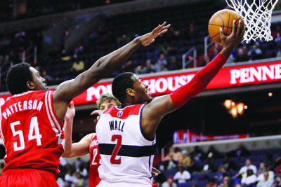 Washington Wizards guard John Wall (2), makes a basket against the Houston Rockets earlier this year. (AP Photo/Jacquelyn Martin)