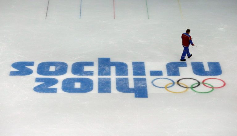 A worker leaves after checking ice conditions at the Iceberg Skating Palace at the 2014 Winter Olympics  on Saturday in Sochi, Russia. (AP Photo/David J. Phillip)