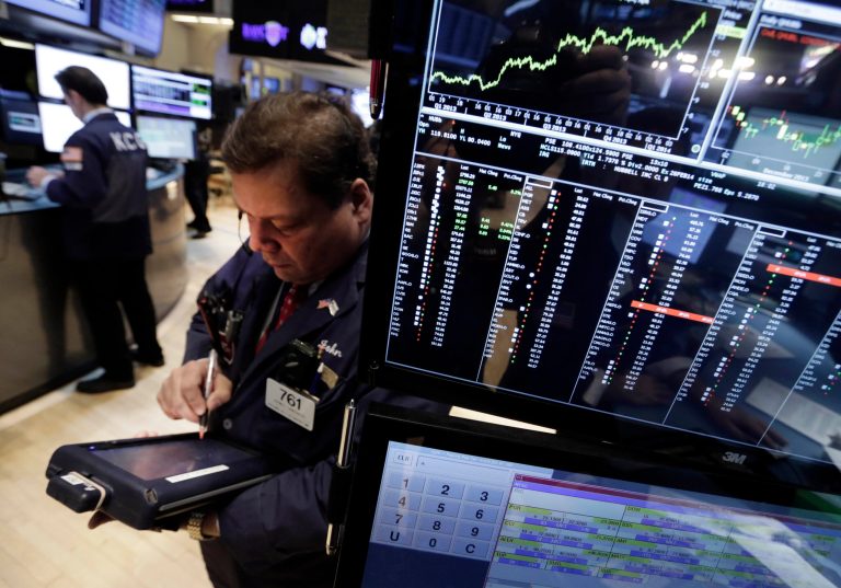 Trader John Santiago works on the floor of the New York Stock Exchange Monday, Jan. 27, 2014. Stocks are mostly higher on Wall Street as investors shrug off worries about emerging markets that tanked the market last week. (AP Photo/Richard Drew)