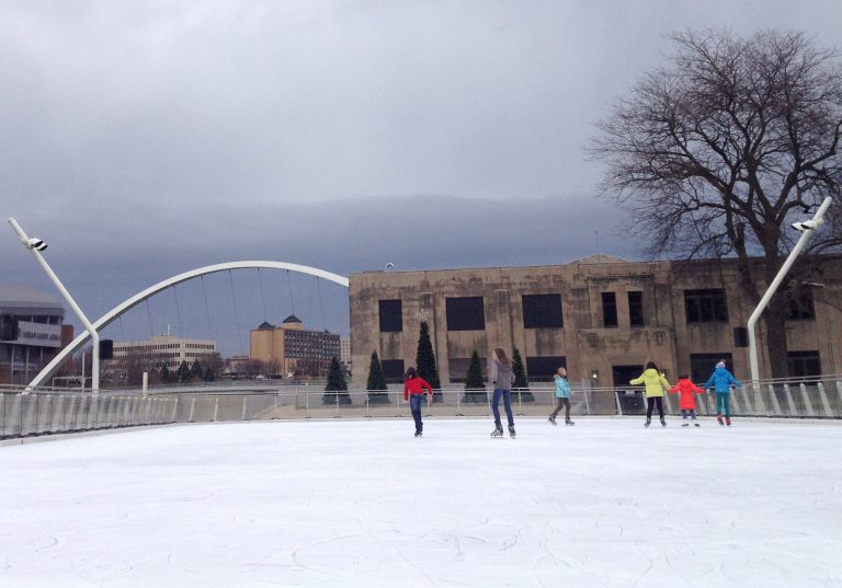   Skates make their way across ice covered with a light snow at Brenton Skating Plaza in downtown Des Moines, Thursday, Dec. 6, 2012. Thursday in Lincoln is the 297th in a row without measurable snow. The former record was 295 snow-free days in 2004. (AP Photo/Barbara Rodriguez)  