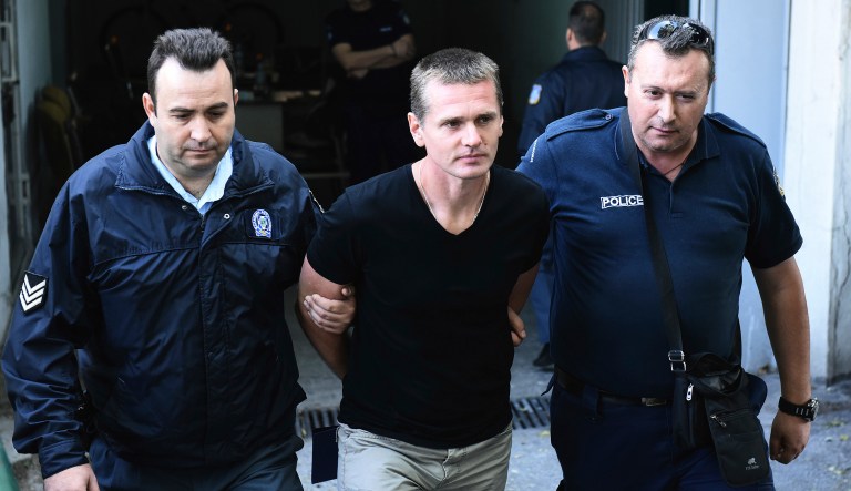 A Greek court decided Wednesday to allow a Russian man accused of masterminding a multi-billion fraud involving bitcoin to be extradited to the U.S. Alexander Vinnik, the suspected money launderer, is wanted by the U.S. and Russia for various cyber crimes involving BTC-e, a digital currency exchange that used bitcoin. (AP Photo/Giannis Papanikos)