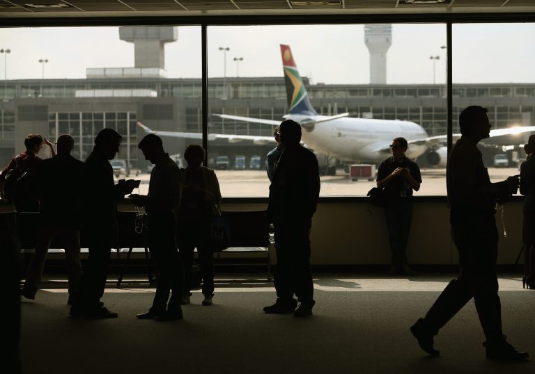 People stand in the main terminal at Washington Dulles International Airport is shown October 2, 2014 in Dulles, Virginia. (Photo by Mark Wilson/Getty Images)