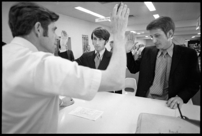   In this May 18, 1970, photo provided by The Minnesota Historical Society, Mike McConnell, left, and Jack Baker attempt to obtain a Hennepin County marriage license in Minneapolis. The couple, both 28 at the time, were blocked from getting a license which prompted a lawsuit that was ultimately rejected by the U.S. Supreme Court in 1972. Four decades later, the couple is still together in Minneapolis as the U.S. Supreme Court prepares to finally revisit the constitutionality of same-sex marriages. (AP Photo/Minnesota Historical Society, R. Bertraine Heine)  