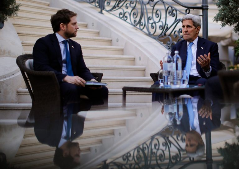 U.S. Secretary of State John Kerry, right, and State Department Chief of Staff Jon Finer, left, at the garden of the Palais Coburg hotel where the Iran nuclear talks meetings are being held in Vienna. (Carlos Barria/Pool via AP)