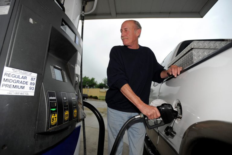 Mike Dawkins, of Royal Oak, pumps gas at a Marathon station in Royal Oak, Monday, June 10, 2013. Michigan and other Upper Midwest states are seeing the highest gasoline prices in the continental U.S. But analysts say the worst is over and prices should begin to drop soon. (AP Photo/The Detroit News, David Guralnick)