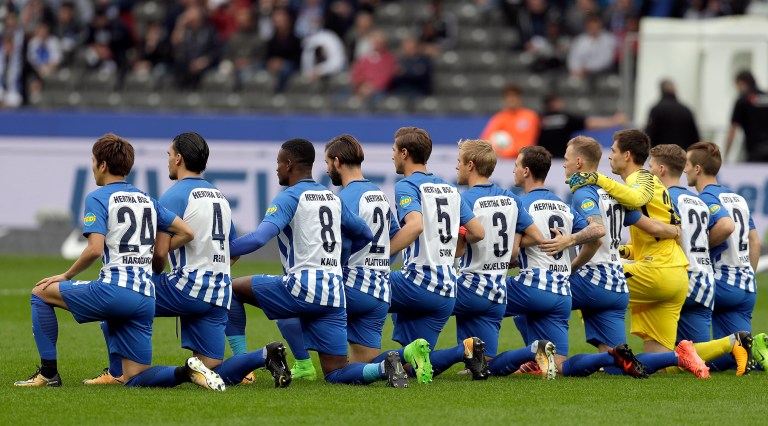 Hertha Berlin nodded to social struggles in the United States by kneeling before its Bundesliga game at home to Schalke on Saturday. (AP Photo/Michael Sohn)