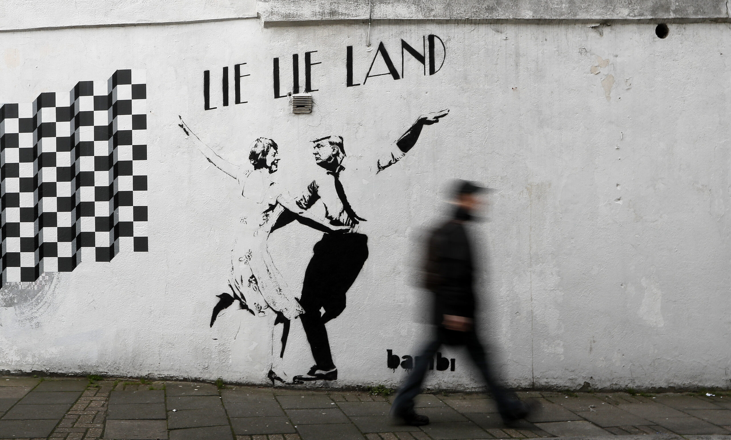 ‘Lie Lie Land’ street art mocks Trump, Theresa May