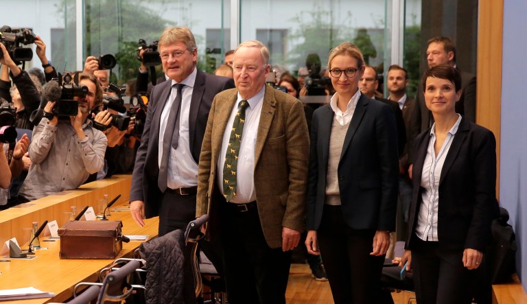 AfD co-chairwoman Frauke Petry, right, and other party leaders arrive for a press conference of the Alternative for Germany, AfD, in Berlin. Petry said that she won't be part of the party's parliament faction on the day after the nationalist party was elected first time into the German parliament. (AP Photo/Markus Schreiber)
