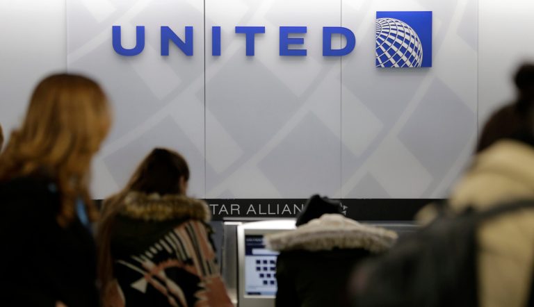 Shares in the airline fell Tuesday as the controversy over the video spread over social media. (AP Photo/Seth Wenig)