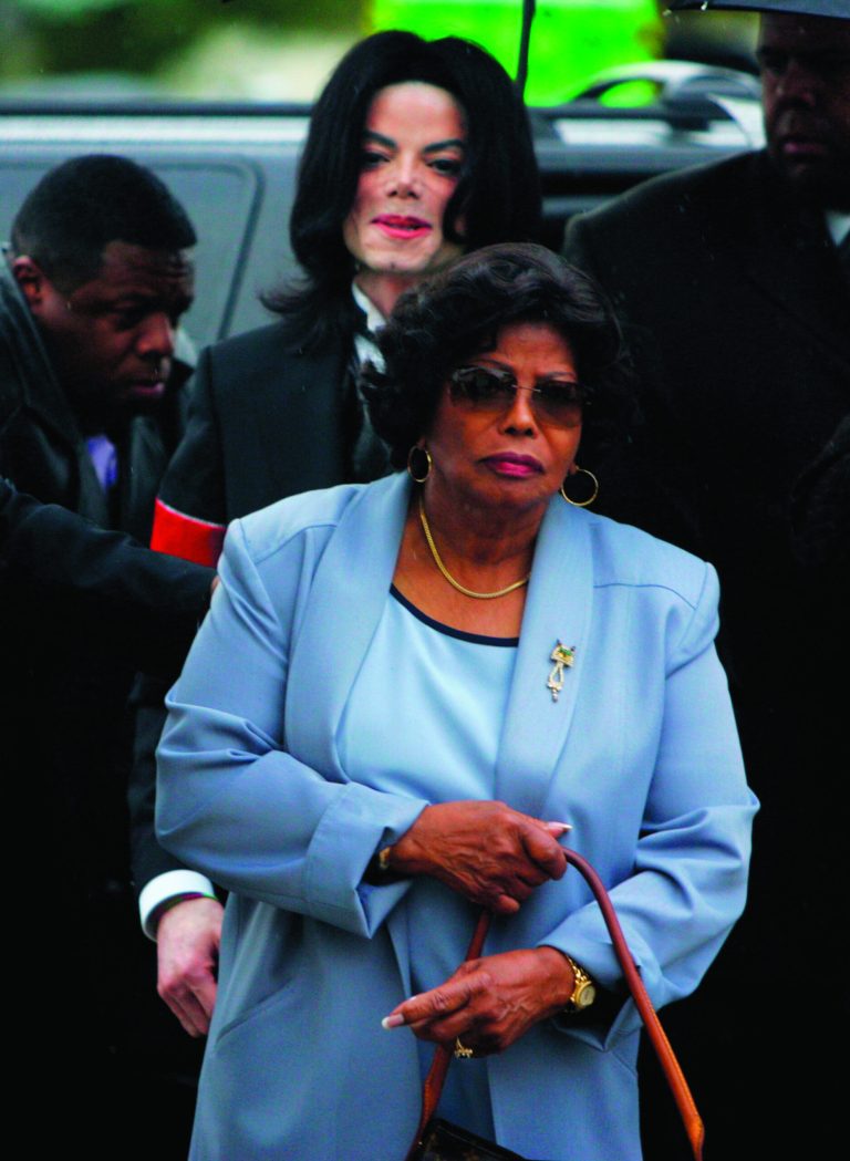 FILE - In this Monday, Feb. 28, 2005 file photo, Michael Jackson follows his mother, Katherine Jackson, as they arrive for court on the opening day of his child molestation trial at Santa Barbara County Superior Court in Santa Maria, Calif. A trial scheduled to begin Tuesday September 6, 2012 will determine how much a businessman working with Katherine Jackson will have to pay her son's estate for infringing some of its copyrights. (AP Photo/Marcio Jose Sanchez, File)