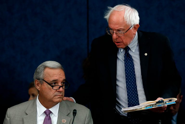 Senate Veterans Affairs Committee Chairman Bernie Sanders, right, speaks with House Veterans Affairs Committee Chairman Jeff Miller during a meeting of the Senate-House Veterans Affairs Conference Committee June 24, 2014 at the U.S. Capitol in Washington. (Photo by Win McNamee/Getty Images)