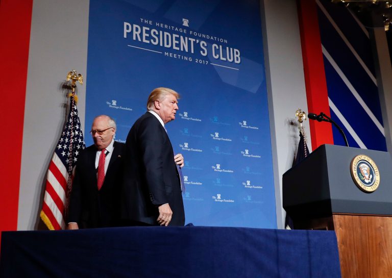 President Donald Trump walks to his podium after being introduced by Heritage Foundation founder and president Ed Feulner, left, before speaking at the Heritage Foundation's annual President's Club meeting, Tuesday, Oct. 17, 2017 in Washington. (AP Photo/Pablo Martinez Monsivais)