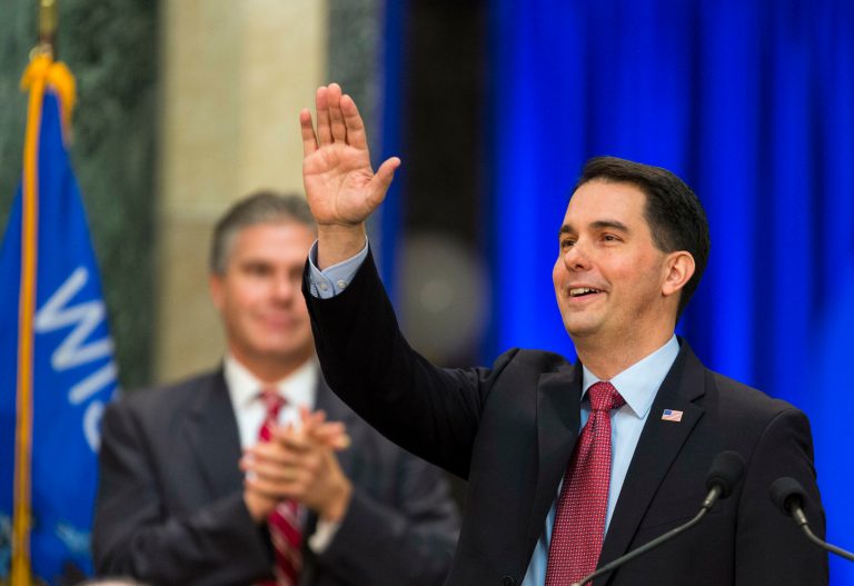 Wisconsin Gov. Scott Walker acknowledges the crowd after being inaugurated for his second term, Monday, Jan. 5, 2015, in Madison. (AP Photo/Andy Manis)