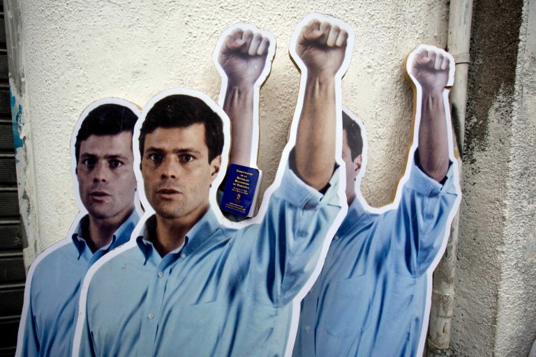 Supporters placed life-size cardboard cutouts of opposition leader Leopoldo Lopez outside the Justice Palace as the trial against Lopez for inciting violence at anti-government protests began, in Caracas, Venezuela, Wednesday, July 23, 2014. Lopez is the head of the Popular Will party. Before turning himself in to authorities in February, he had been spearheading a movement to force President Nicolas Maduro's resignation. (AP Photo/Fernando Llano)