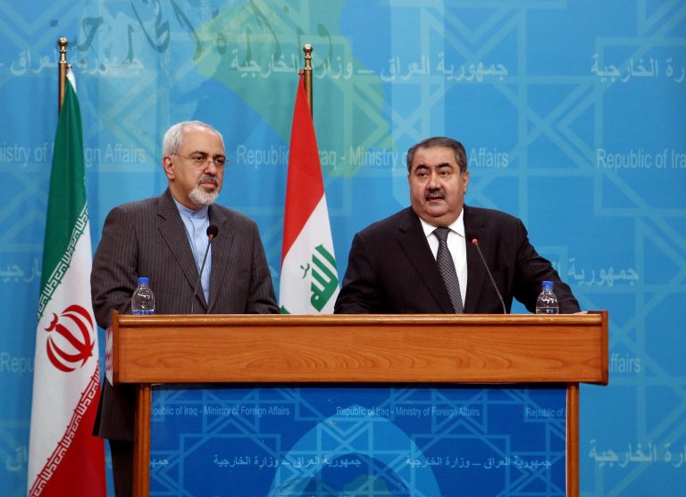 Iraqi Foreign Minister Hoshyar Zebari, right, speaks to the media during a joint press conference with his Iranian counterpart Mohammad Javed Zarif in Baghdad, Iraq, Tuesday. (AP Photo/Khalid Mohammed)