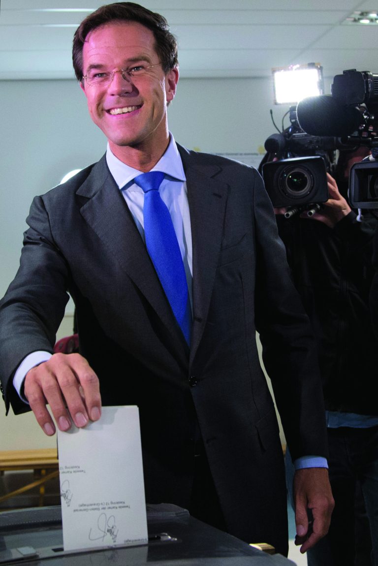 Dutch Prime Minister and Liberal Party leader Mark Rutte casts his vote for parliamentary elections in The Hague, Netherlands, Wednesday Sept. 12, 2012. (AP Photo/Peter Dejong)