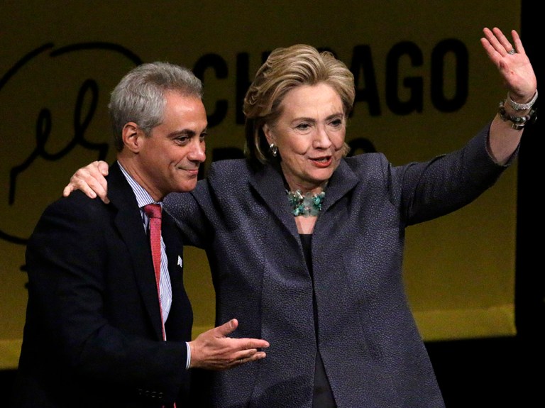 Hillary Clinton, with Chicago Mayor Rahm Emanuel, waves to the crowd during her visit to Chicago, Wednesday, June 11, 2014. (AP Photo/Stacy Thacker)