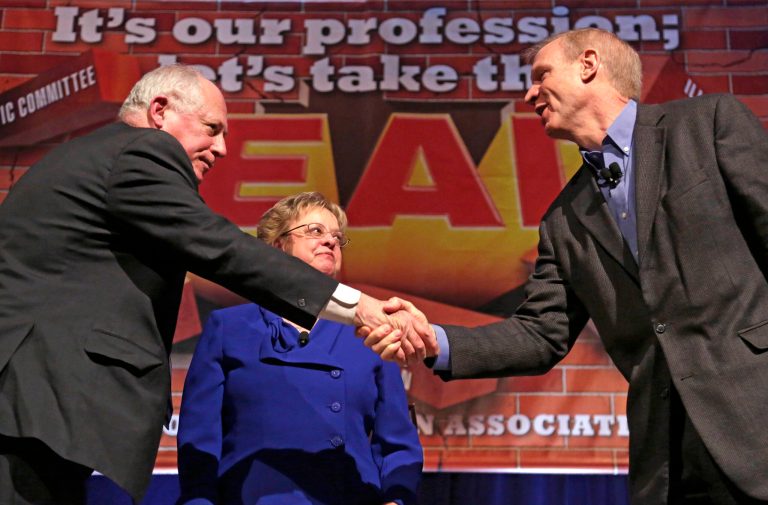 FILE - In this April 11, 2014 file photo, Illinois Gov. Pat Quinn, left, and his Republican rival, venture capitalist Bruce Rauner, shake hands after they appeared together at the annual meeting of the Illinois Education Association in Chicago. Locked into one of the nation's closest gubernatorial races, Quinn is focusing on a key theme as he tries to keep Rauner from becoming the first Republican in more than a decade to run Illinois: picking apart Rauner's private equity firm investments and how he made hundreds of millions of dollars. The tactic, used to portray Rauner as a heartless multimillionaire, mimics President Barack Obama campaign's portrayal of another businessman _ Republican presidential nominee Mitt Romney in 2012. (AP Photo/M. Spencer Green, File)