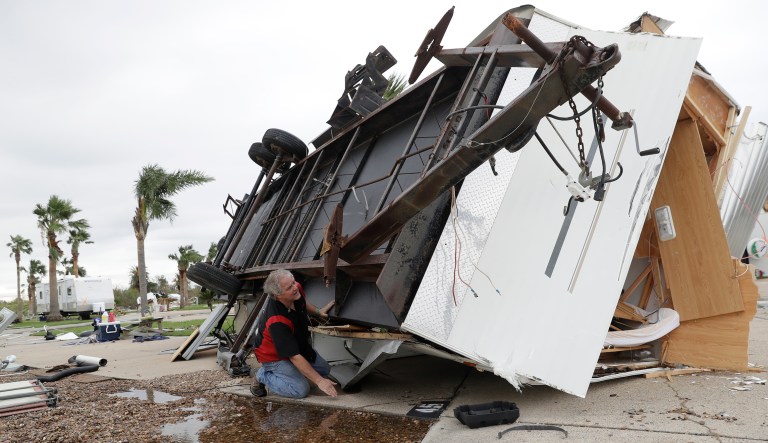 GOP criticism of disaster-spending bills is fueled by reports that the legislation becomes a magnet for projects that are not directly related to the disaster. Todd Witherington searches his trailer that was overturned by the effects of Hurricane Harvey om Monday in Aransas Pass, Texas. (AP Photo/Eric Gay)