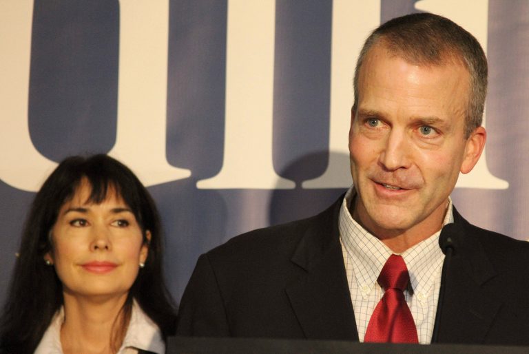 Dan Sullivan, right, speaks while announcing a U.S. Senate bid in Anchorage, Alaska, in 2013. On the left is his wife, Julie Fate Sullivan. (AP Photo/Mark Thiessen)