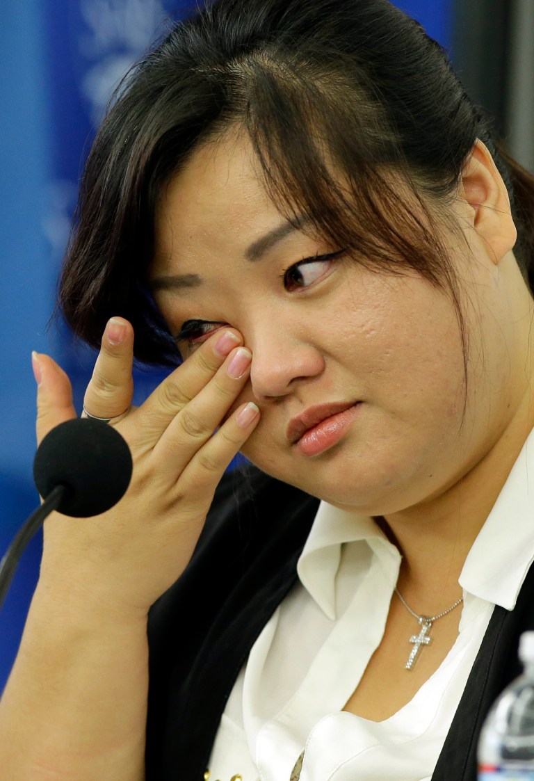 Jin hye Jo wipes a tear as she testifies during a hearing of the United Nations mandated Commission of Inquiry about the human rights situation in the Democratic People's Republic of Korea, at the Johns Hopkins School of Advanced International Studies, Wednesday, Oct. 30, 2013, in Washington. Jo wiped the tear while talking about her brother dying in her arms. (AP Photo/Alex Brandon)