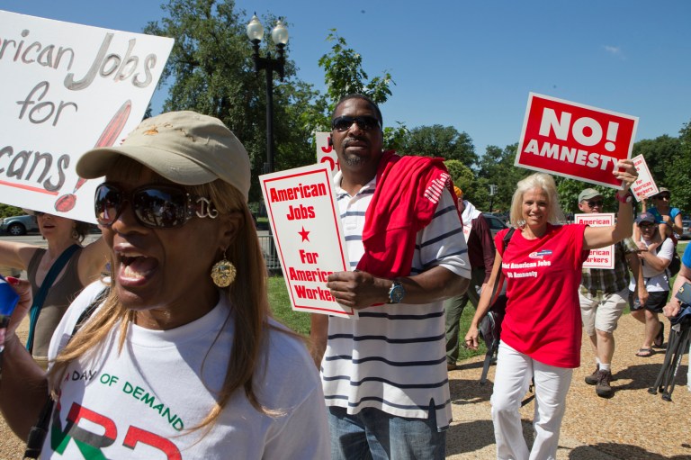 People opposed to current immigration legislation in Congress gather at a rally on Capitol Hill in Washington, Monday, July 15.  (AP/J. Scott Applewhite)