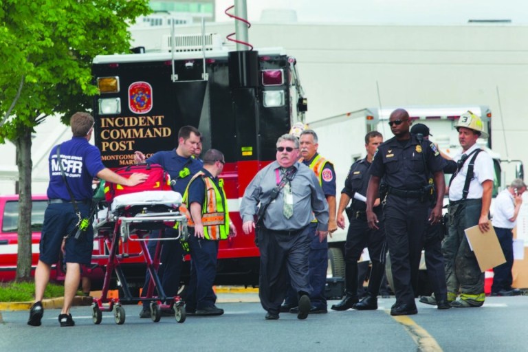 First responders at the scene of a partially collapsed parking garage at the Westfield Montgomery Mall on Thursday. One construction worker was killed and another severely injured.