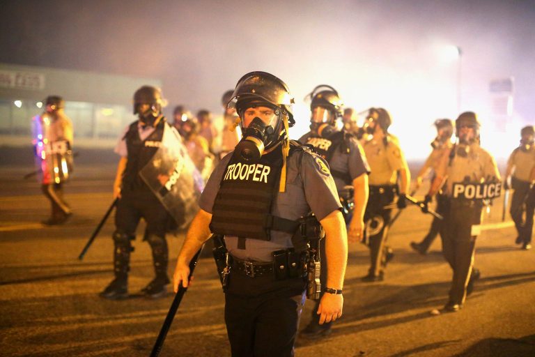 Police advance through a cloud of tear gas toward demonstrators on August 17, in Ferguson, Mo. (Getty images/Scott Olson)