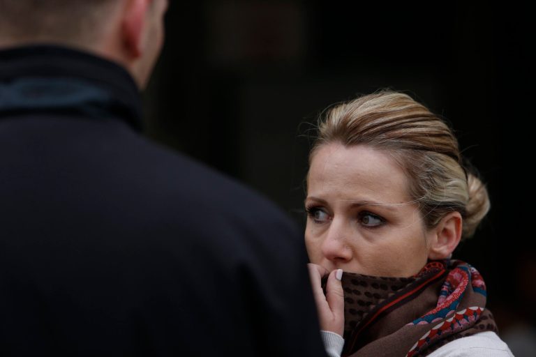 Bosnian woman Denisa Hegic reacts as she enters at the Sejkovaca identification center, near the Bosnian town of Sanski Most, 260 kilometers (162 miles) northwest of Sarajevo ,on Wednesday, April 16, 2014. Denisa Hegic was eight when Serb soldiers stormed her house and killed her entire family at the beginning of the 1992-95 Bosnian war. An aunt pulled her away from her mother's bloody body and they tried to run away, were caught but escaped again. After 22 years, Hegic reunited with her family on Wednesday at the freezing mortuary where the remains of hundreds of Muslim Bosniaks killed during the Bosnain Serb ethnic killings campaign are stored after they were excavated from Bosnia's biggest mass grave. (AP Photo/Amel Emric)