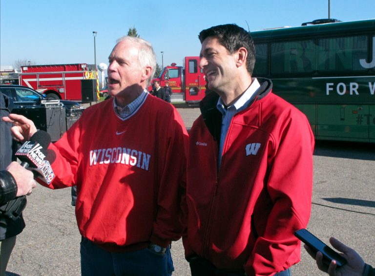 In this Nov. 4, 2016 photo, U.S. House Speaker Paul Ryan, right, and Republican Sen. Ron Johnson, of Wisconsin, meet with reporters as they campaign together on Friday, Nov. 4, 2016, in Mosinee, Wis. (AP Photo/Scott Bauer)