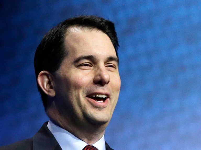 Gov. Scott Walker's landmark reforms -- including guaranteeing workers the right not to be forced to pay dues to a union they don't want to join -- is costing SEIU thousands of members. (AP Photo)