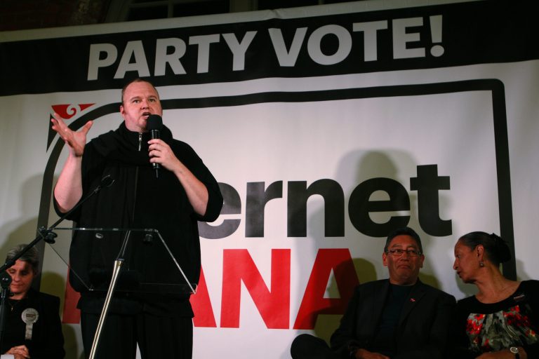In this Monday, Aug. 4, 2014 photo, indicted Internet entrepreneur Kim Dotcom speaks at a political rally, in Wellington, New Zealand. The Internet Mana Party that Dotcom is funding appears likely to win two or three seats in New Zealand's Parliament when the nation goes to the polls Saturday, Sept. 20, 2014. (AP Photo/Nick Perry)