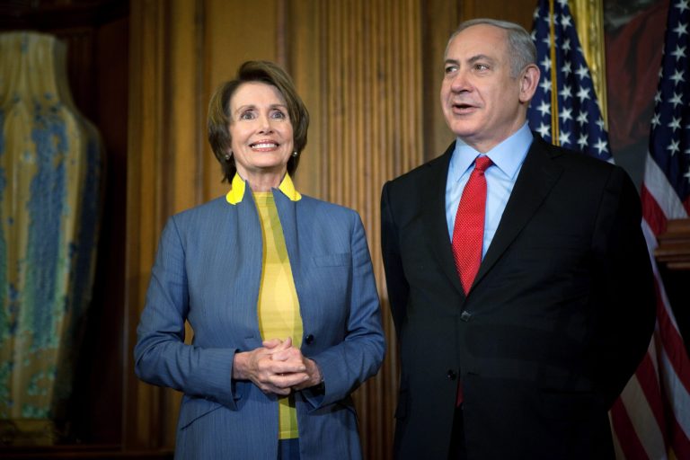 Israeli Prime Minister Benjamin Netanyahu speaks while U.S. House Minority Leader Nancy Pelosi looks on at a press conference during a meeting in the U.S. Capitol building March 6, 2012 in Washington. (Photo by Allison Shelley/Getty images)