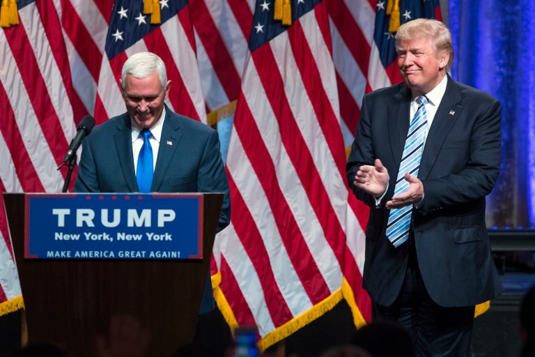 Indiana governor kicks off his first campaign event with Trump by attacking Clinton. (AP Photo/Evan Vucci)